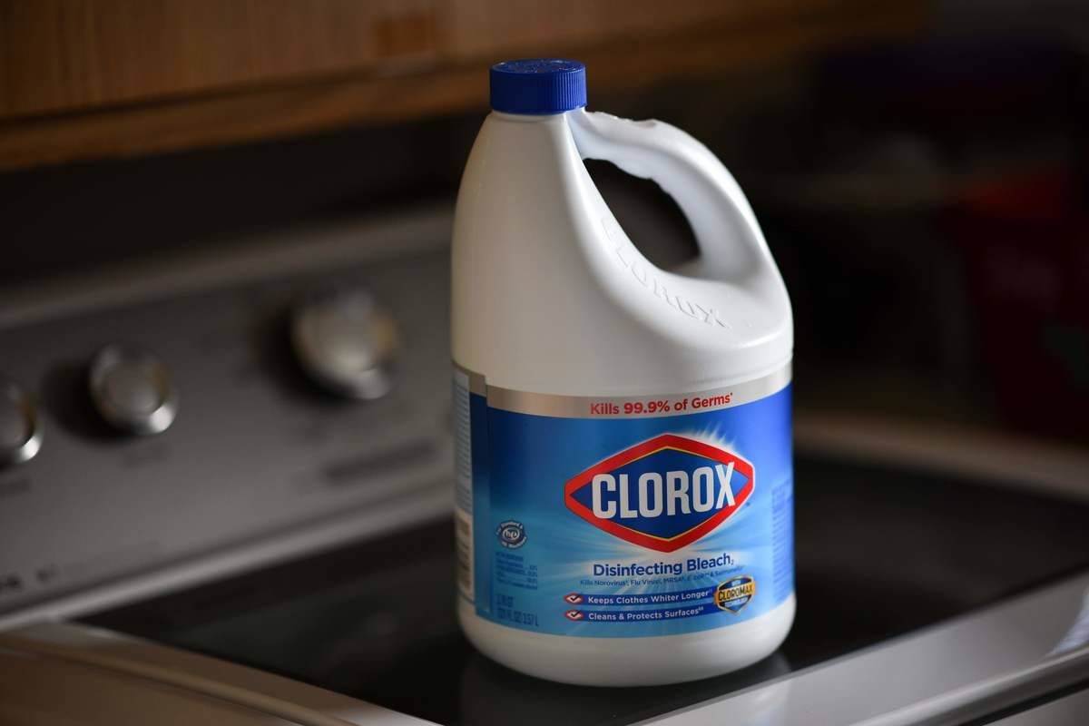 bleach A container of Clorox bleach sits on a stovetop.