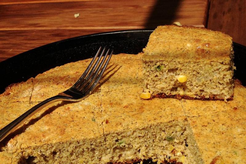 cornbread Squares of cornbread are cut out of a pan.