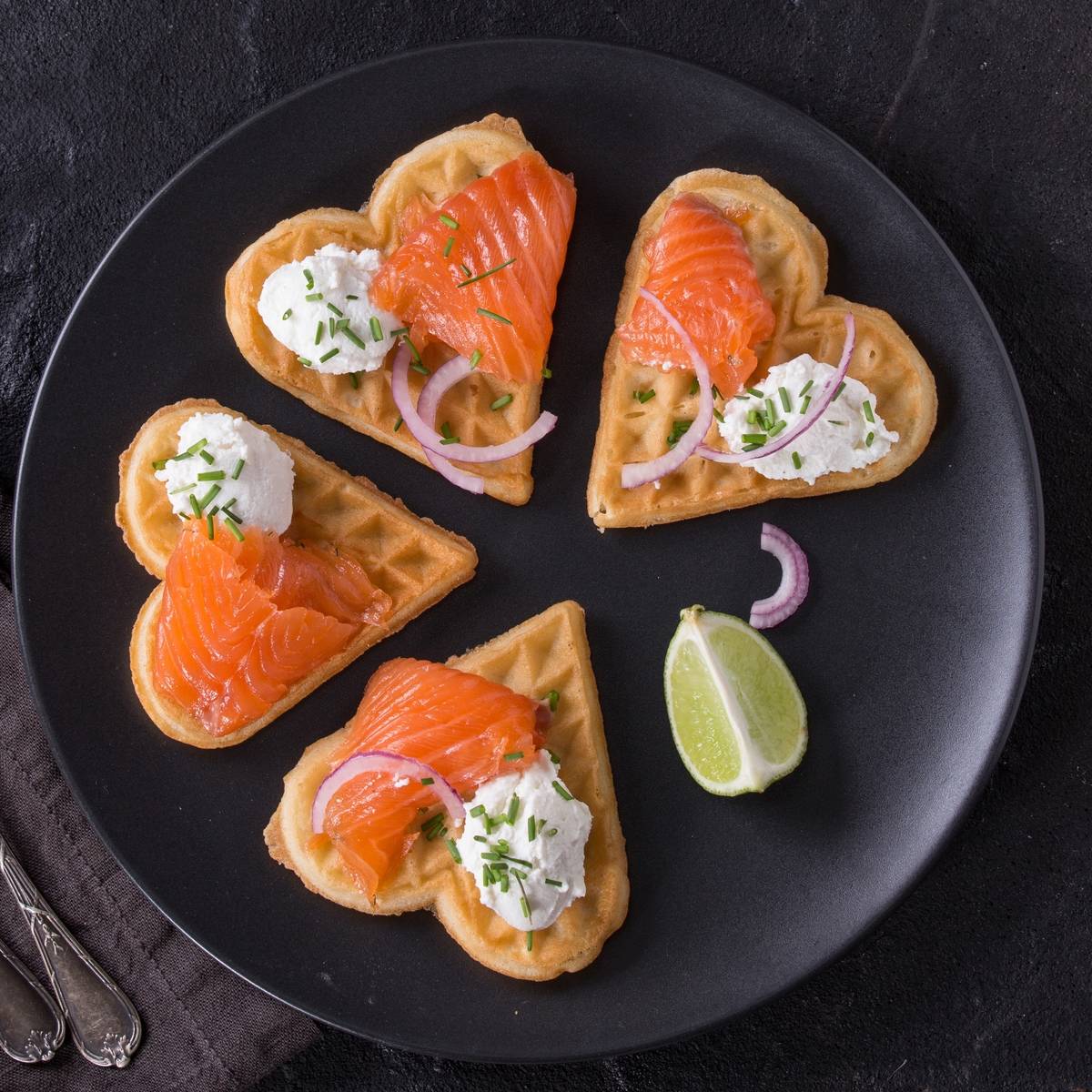 Salmon is on wafers shaped as hearts.