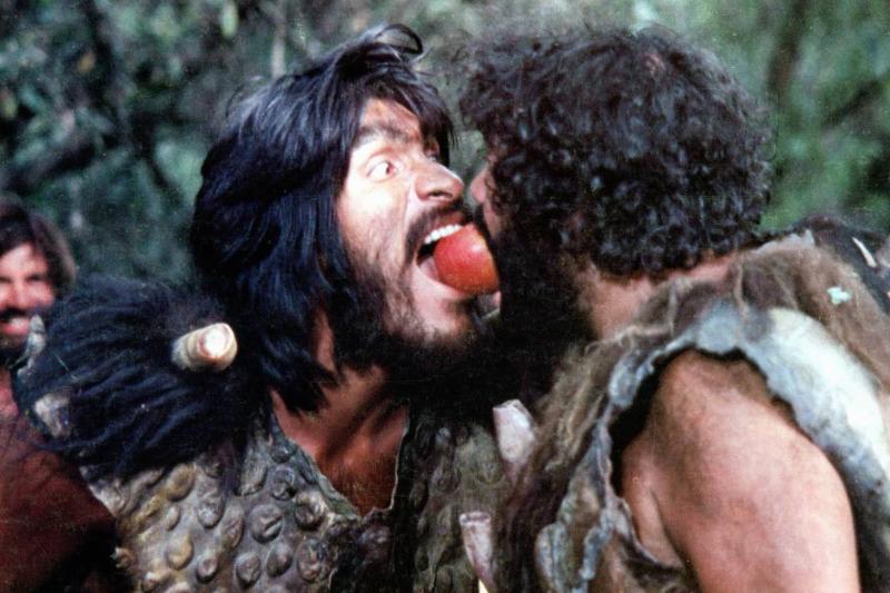 apple Two Neanderthals bite the same apple in the 1981 movie