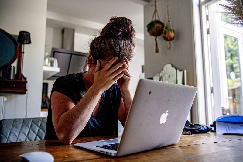 In this photo illustration a woman appears to be stressed as...