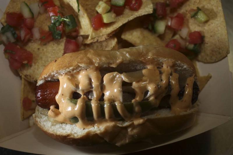 Tres Agaves serves a bacon-wrapped hot dog at AT&T Park on Wednesday April 22, 2009 in San Francisco, Calif.