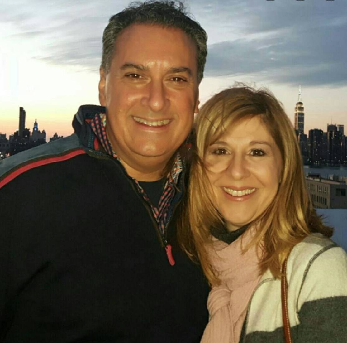 Joe and Jennifer Cartellone smile for a photo together.