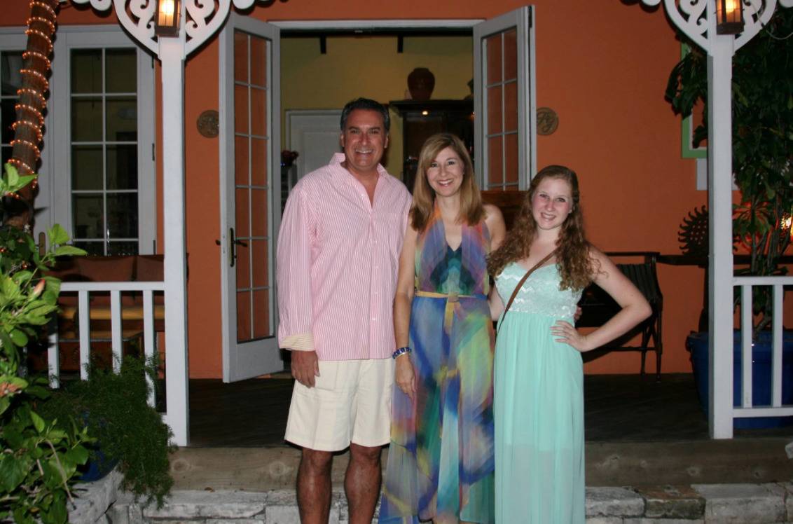 The Cartellone family poses for a photo in front of a restaurant.