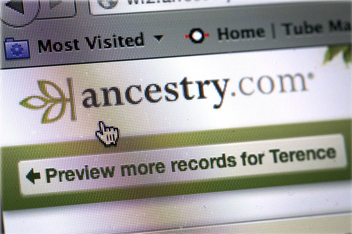 A woman checks her ancestry connections on her iPad on ancestry.com.