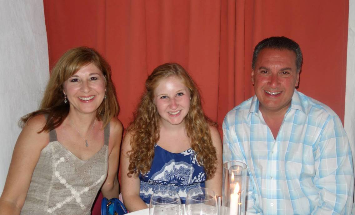 The Cartellone family is photographed during a dinner at a restaurant.