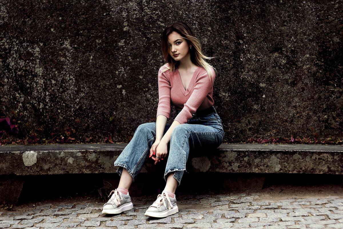 a girl sitting outside
