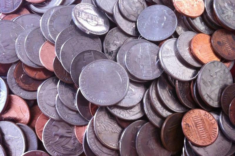 american coins A variety of coins lie in a pile.