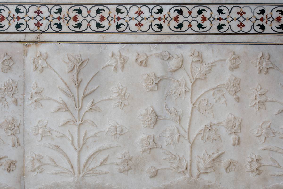 flower marble A delicate floral relief sculpture on the ivory marble walls of the Taj Mahal.