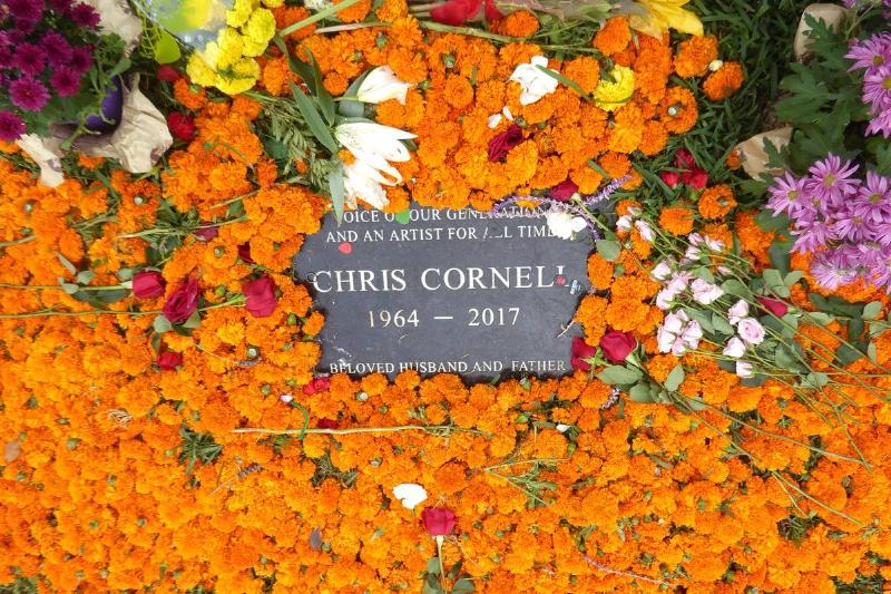 Dozens of flowers in a variety of colors surround Chris Cornell's grave.