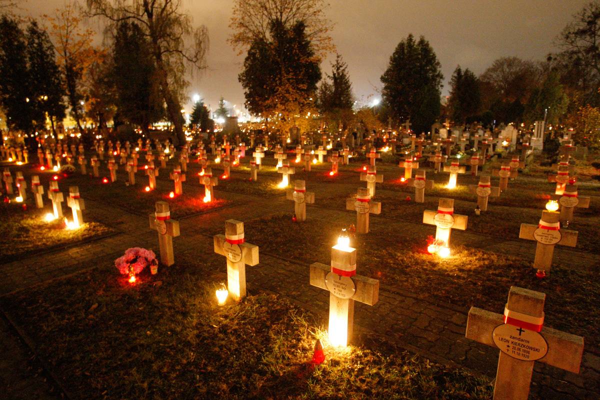 vigil A cemetery in Poland lites its graves during a vigil of All Souls.