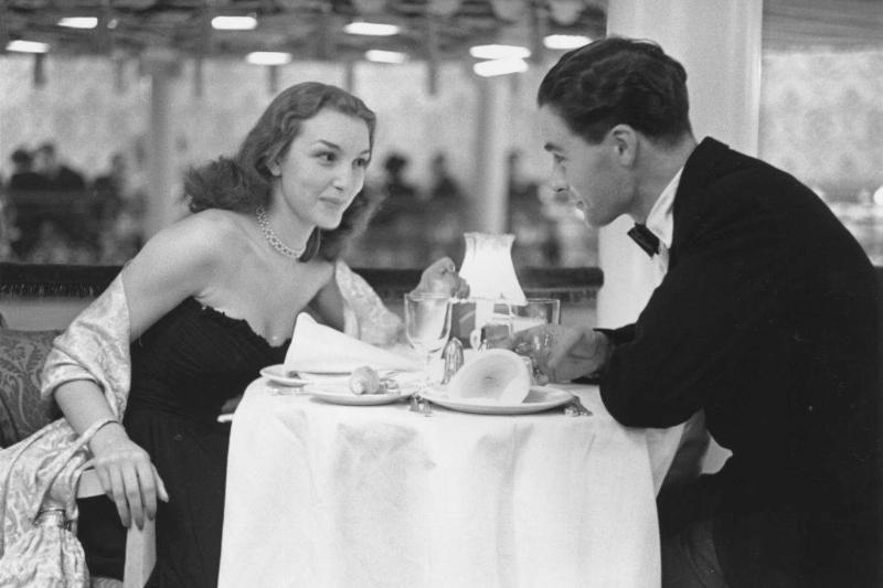 dressing up 2639043 a couple dressed up at a restaurant black and white photo