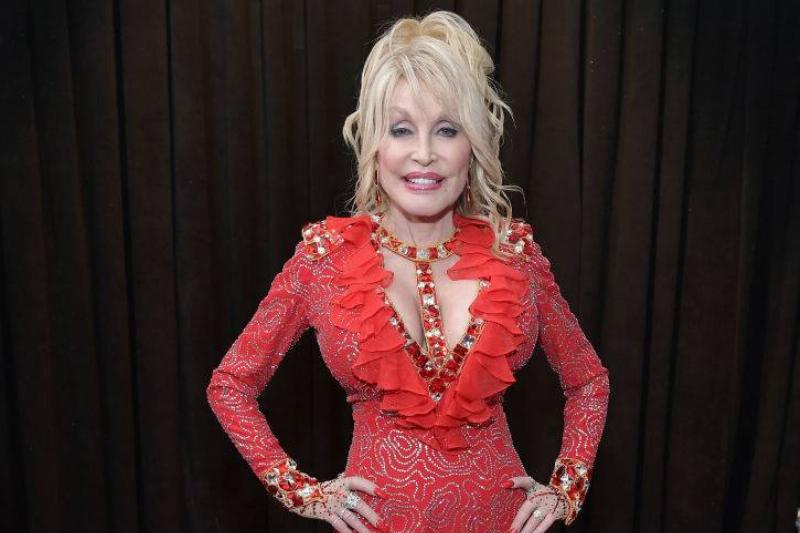 bare face 1097522568 Dolly Parton in a red dress