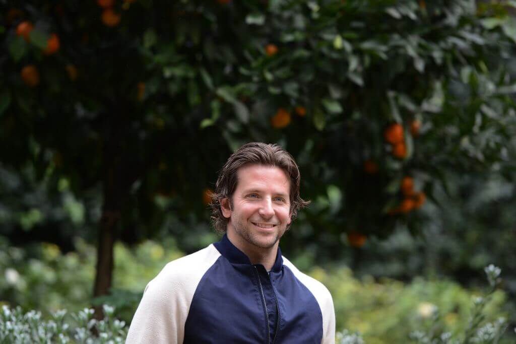 Bradley Cooper smiles outside