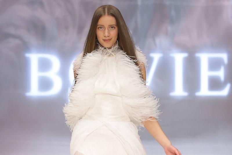 feather shirt SYDNEY, AUSTRALIA - AUGUST 21: A model showcases designs by Bowie on the catwalk as part of Mercedes Benz Fashion Festival Sydney 2012 at Sydney Town Hall on August 21, 2012 in Sydney, Australia.
