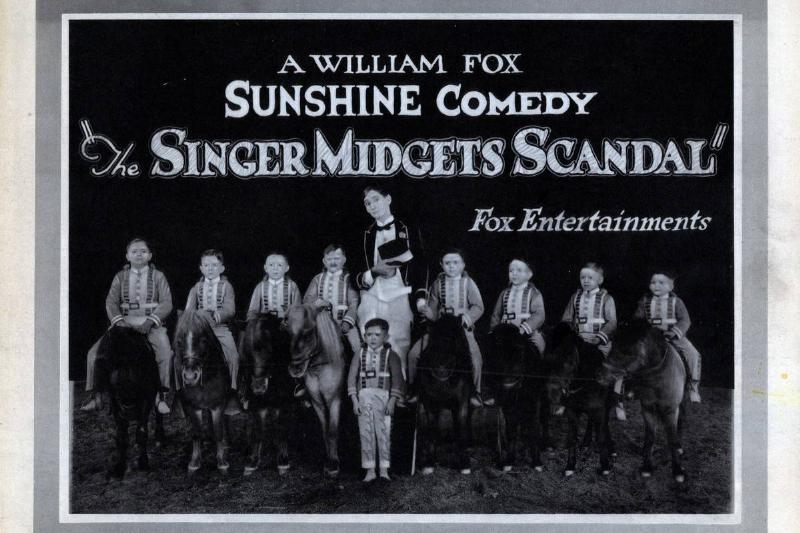 The Singer Midget's Scandal The Singer Midget's Scandal, lobbycard, Slim Summerville, (center), the Singer Midgets, 1921.