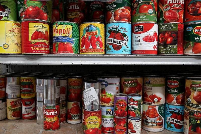 tomatoes 487634433 Canned tomatoes line the shelves of a pantry