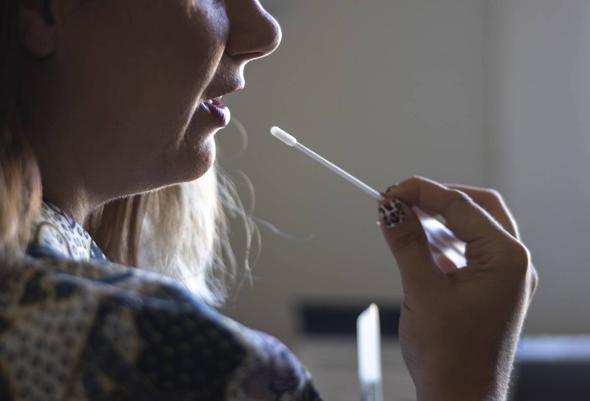 DNA A reporter collects a saliva sample for an Orig3n Inc.