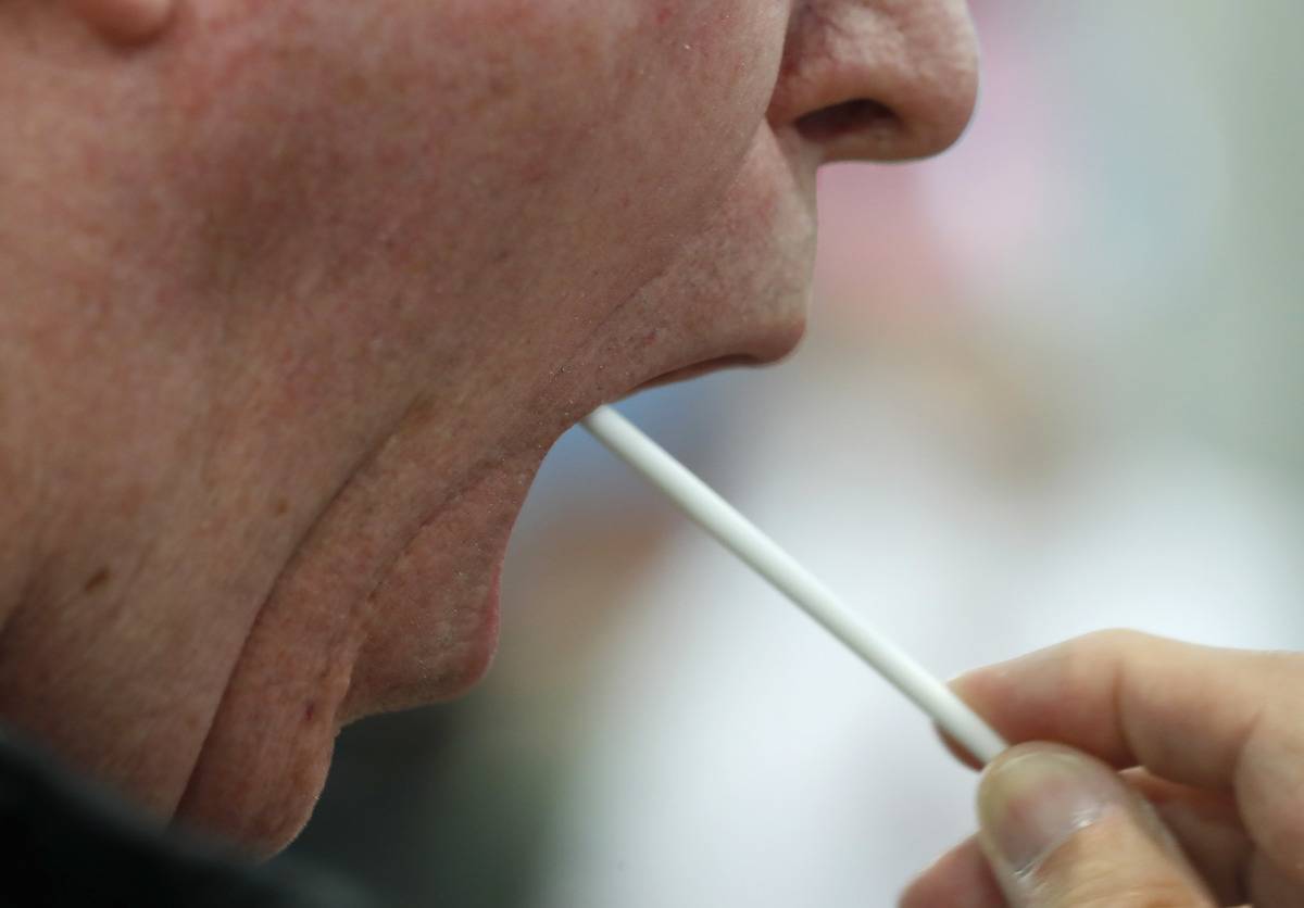 DNA An attendee uses a swap to test DNA at the MyHeritage UK Ltd. booth on the exhibition floor of the 2017 RootsTech Conference in Salt Lake City, Utah, U.S.
