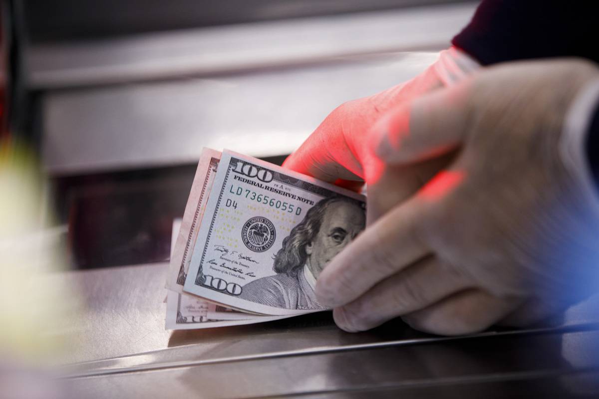 Inside A Wal-Mart Stores An employee counts cash at a Wal-Mart Stores Inc. location in Burbank, California, U.S