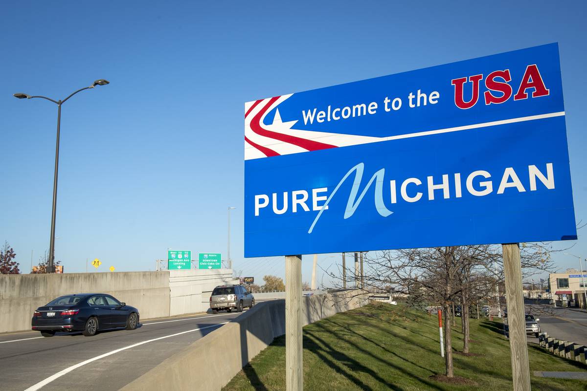 Michigan A sign welcoming travelers is pictured near the Ambassador Bridge that connects Detroit and Windsor, Canada on November 8, 2021