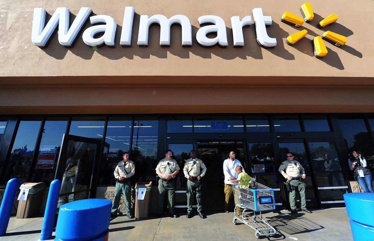 Security Police man the front of a Walmart store amid heightened security in Paramount, California on November 23, 2012