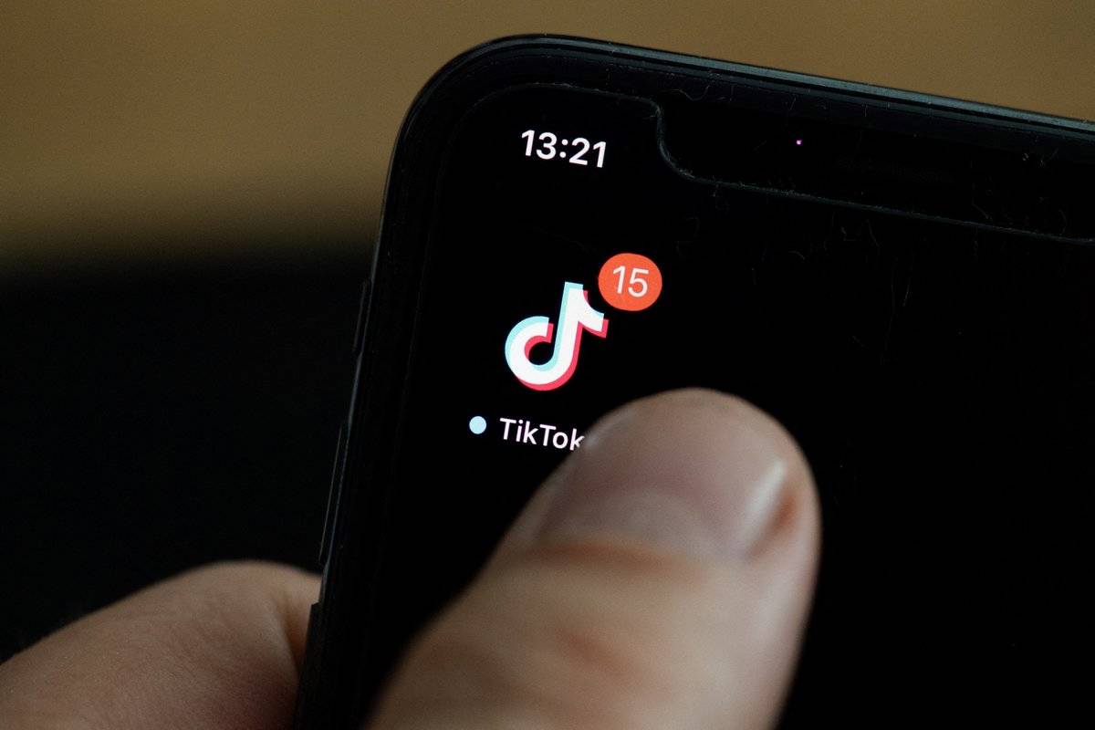 TikTok This illustration picture taken on May 27, 2020 in Paris shows the logo of the social network application Tik Tok on the screen of a phone.
