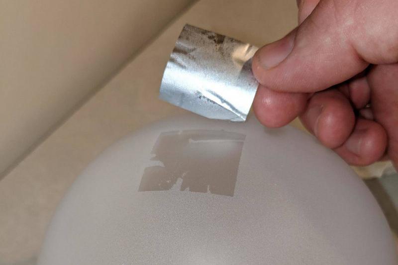 sticker on lamp sticker on lamp being peeled