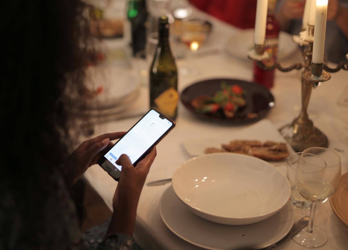 Woman taking pics on phone