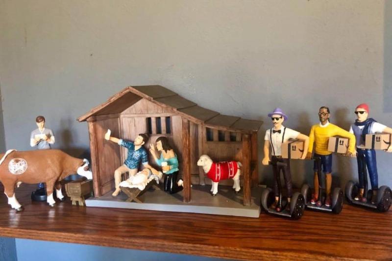 Nativity scene decorated with millennial figurines and hipster Magi on segways