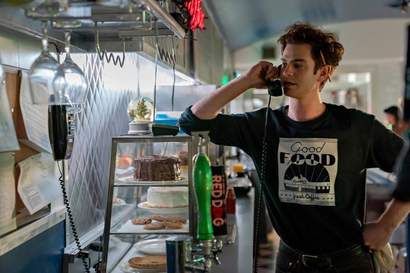 andrew garfield on the phone at the diner