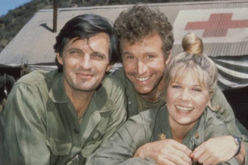 Alan Alda, Wayne Rogers, and Loretta Swit leaning on jeep in MASH Alan Alda, Wayne Rogers, and Loretta Swit leaning on jeep in MASH