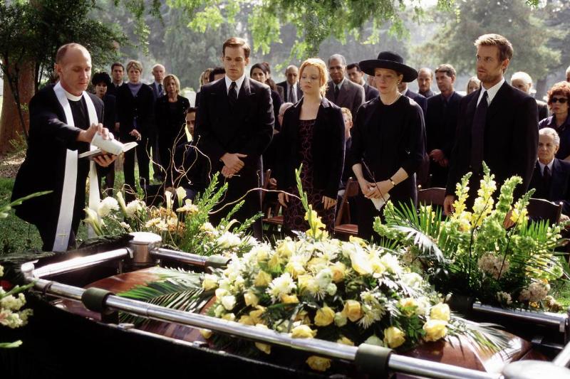 The fisher family looking at closed casket adorned with flowers in Six Feet Under The fisher family looking at closed casket adorned with flowers in Six Feet Under