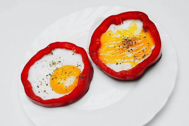 fried eggs inside bell peppers cut in half fried eggs inside bell peppers cut in half