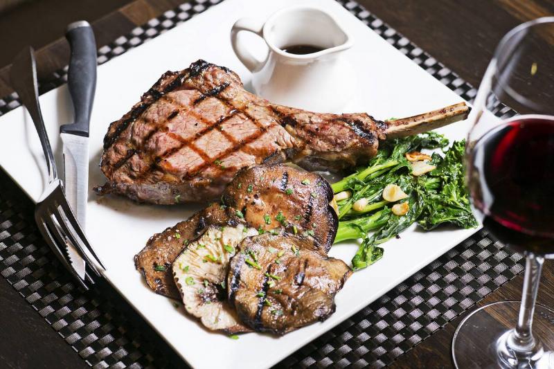 The grilled veal chop with whole shiitake mushrooms and broccoli rabe at Osteria Marzano.