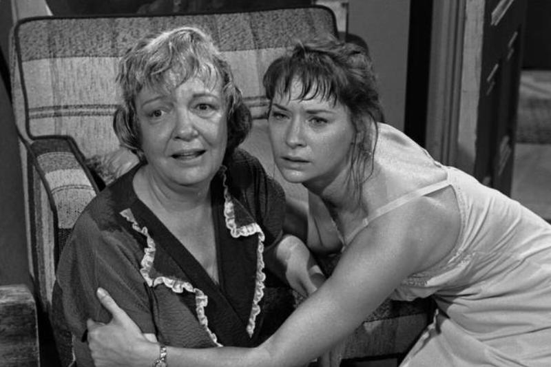 women embracing in fear while keeling on floor in The Twilight Zone women embracing in fear while keeling on floor in The Twilight Zone