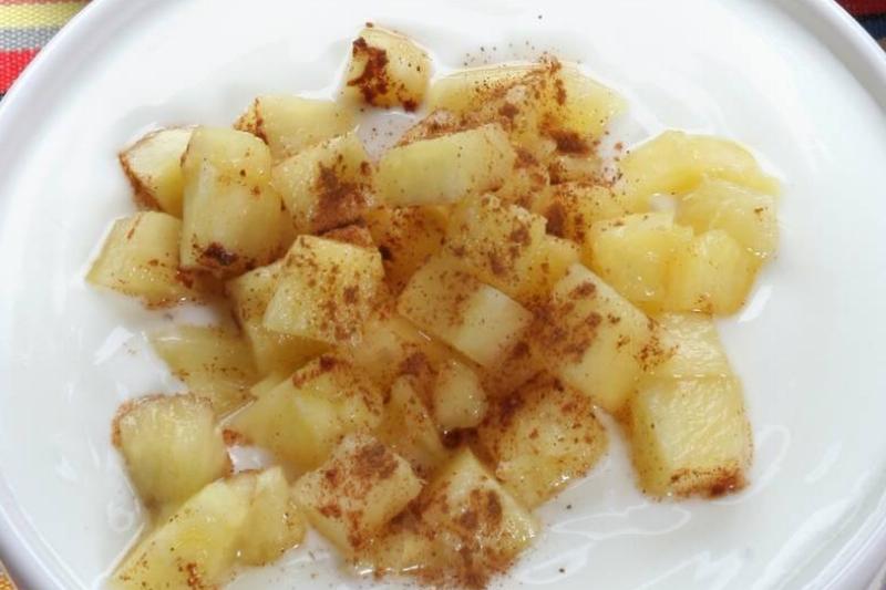 Yoghurt with Muesli breakfast cereals and pineapple with cinnamon. Italy Yoghurt with Muesli breakfast cereals and pineapple with cinnamon. Italy