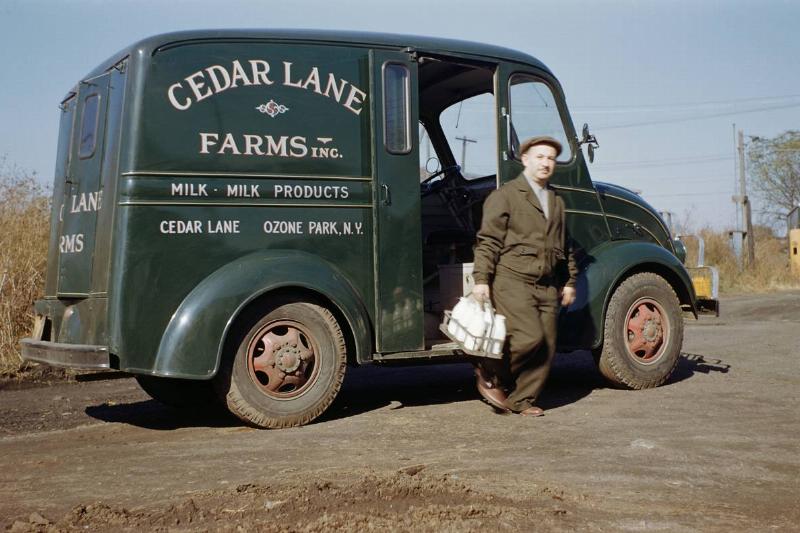 Milkman Stepping out of Milk Truck Milkman Stepping out of Milk Truck