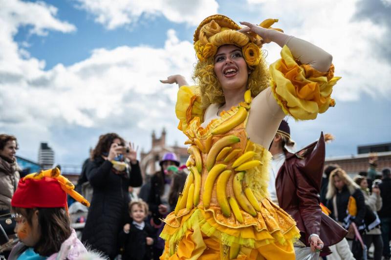 A woman dressed with a fancy costume of bananas during the... A woman dressed with a fancy costume of bananas during the...