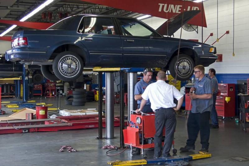 Motor car on hydraulic lift repair workshop Springfield Missouri USA Motor car on hydraulic lift repair workshop Springfield Missouri USA