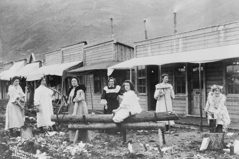 Women Sawing Logs in Dawson Women Sawing Logs in Dawson