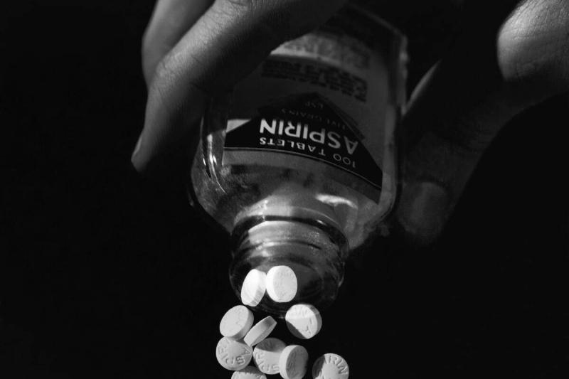 Hand Pouring Aspirin from Bottle Hand Pouring Aspirin from Bottle