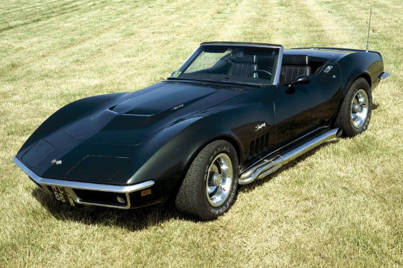 A 1969 Chevrolet Corvette Stingray in a field. A 1969 Chevrolet Corvette Stingray in a field.