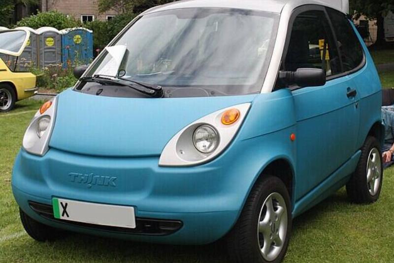 Ford TH!NK City parked on grass