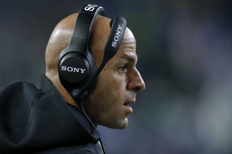 Robert Saleh wearing a headset