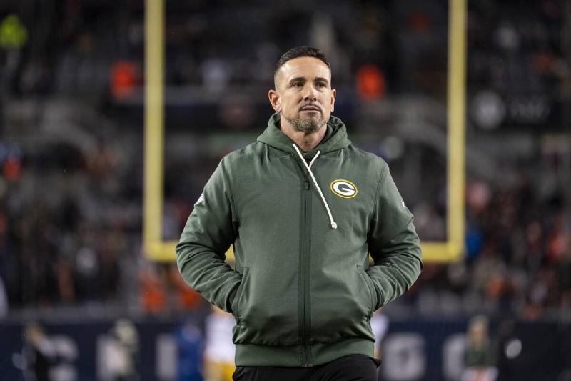 Matt LaFleur walking through a football stadium