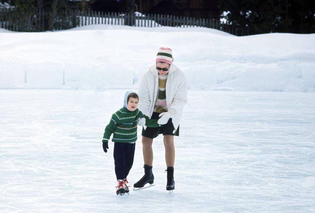 Grace Kelly and her daughter, Stéphanie, skating outside on a snowy day