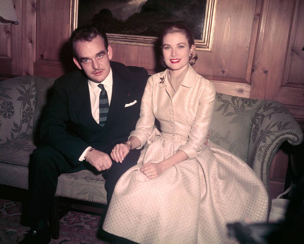 Prince Rainier and Grace Kelly sitting together on a couch