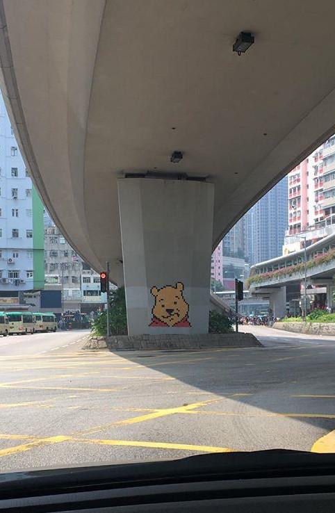 A wild sticky-note Winnie the Pooh suddenly appears in Hong Kong.