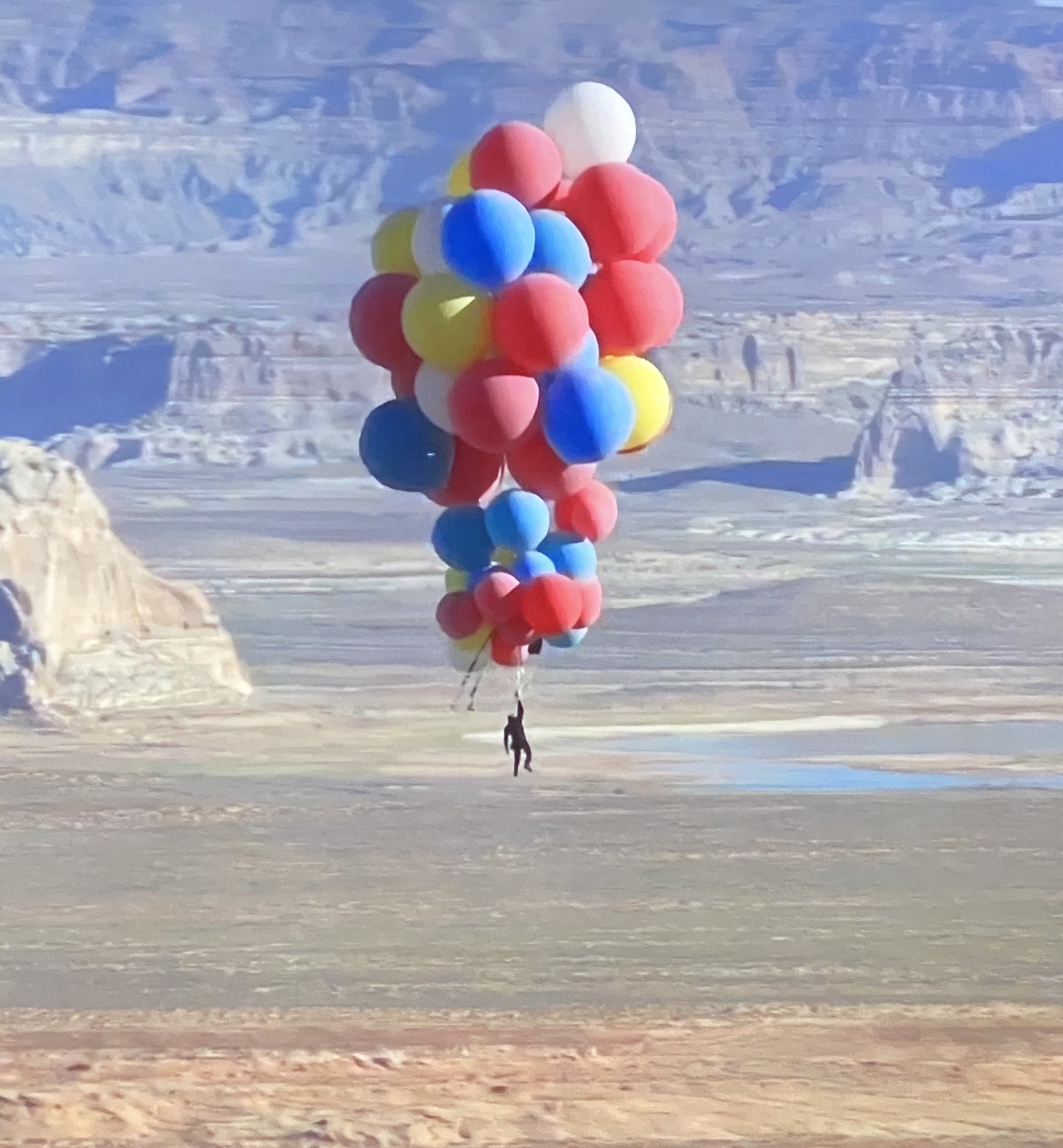 David Blaine nonchalantly floating over Arizona holding 52 helium balloons.